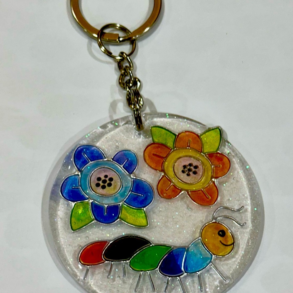 Floral caterpillar round 2.5 inch acrylic keychain